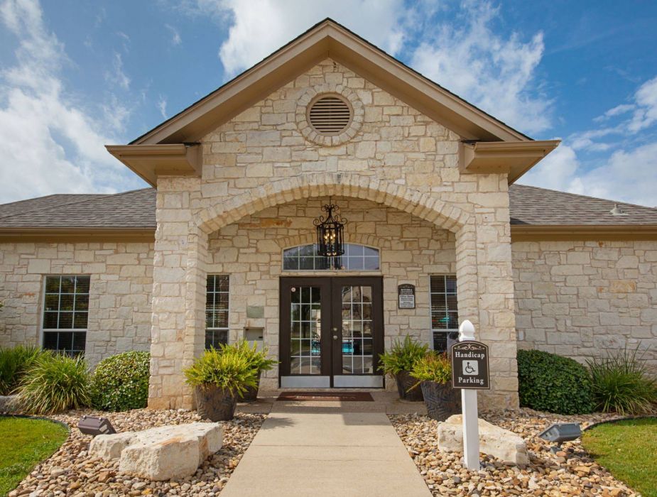 Riviera Apartments in Waco, TX community leasing office building exterior showing the office entrance